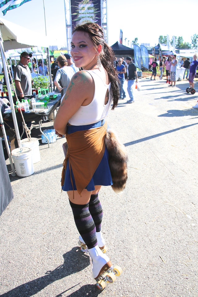 This attendee was rolling at the Cup — on wheels with a raccoon tail!