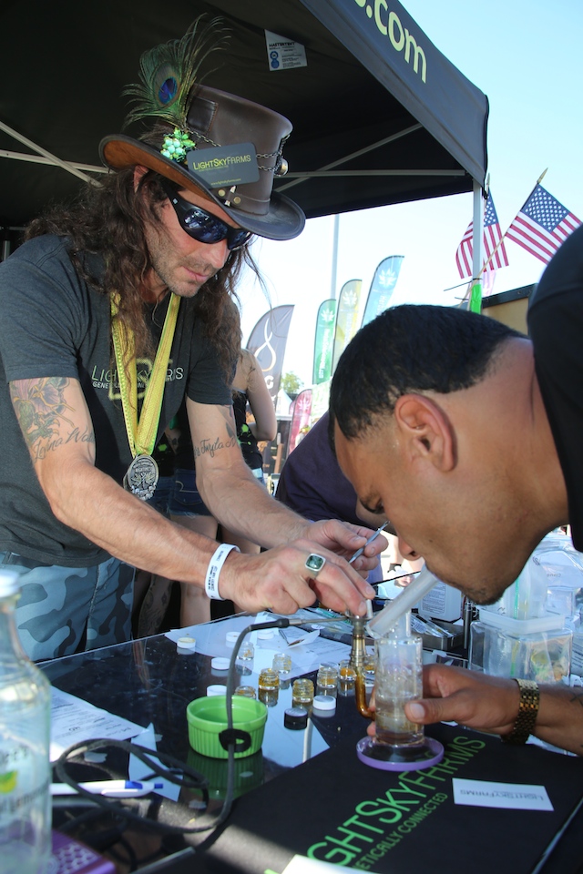 At Light Sky Farms, the dab attendant wore his Cannabis Cup medal.